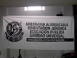 Pancarta, en la Parroquia San Carlos Borromeo, con los cuatro ejes de la RSP